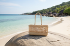 Woven handbag on a beige background